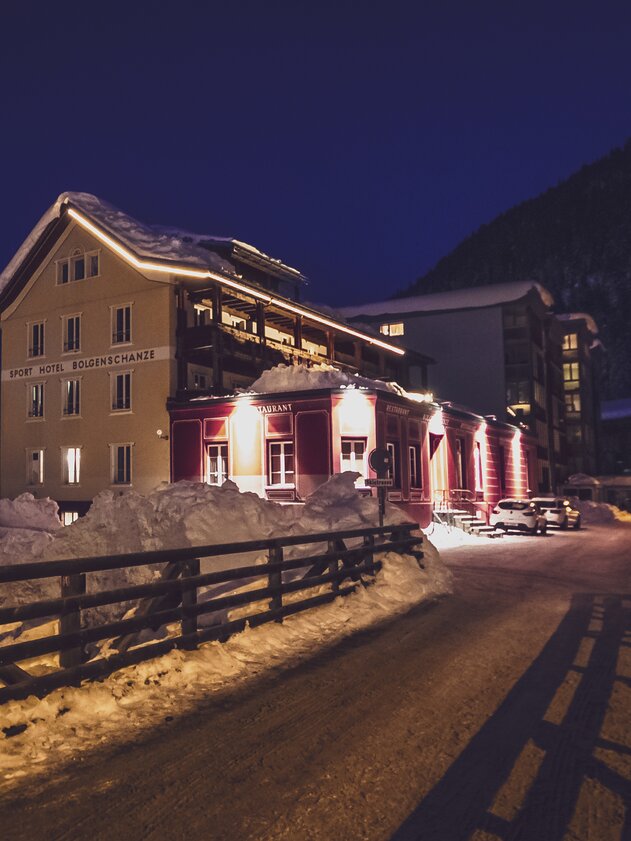  Exterior view of the Bolgenschanze bar during a winter night.