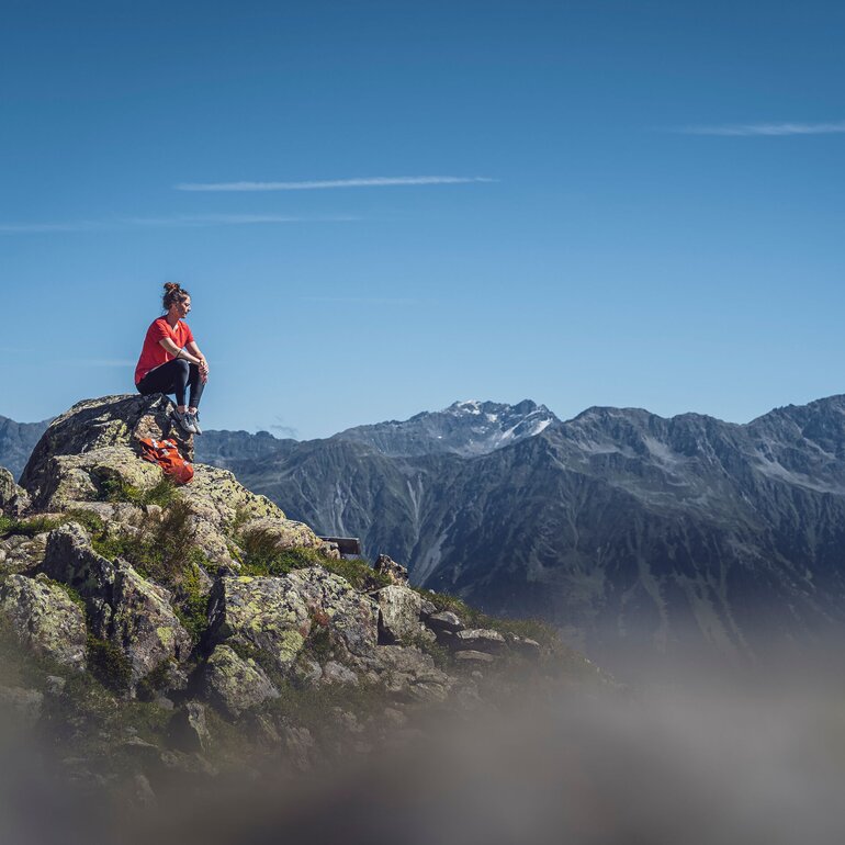 Person sitting on rock  | © Davos Klosters Mountains 